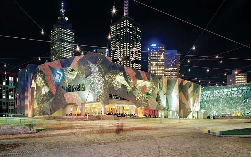 federation square at night in melbourne